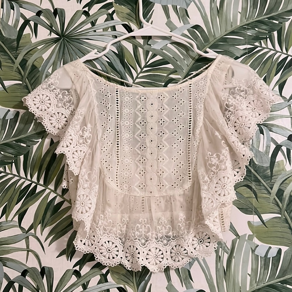 Open back white lace crop top w/tassel